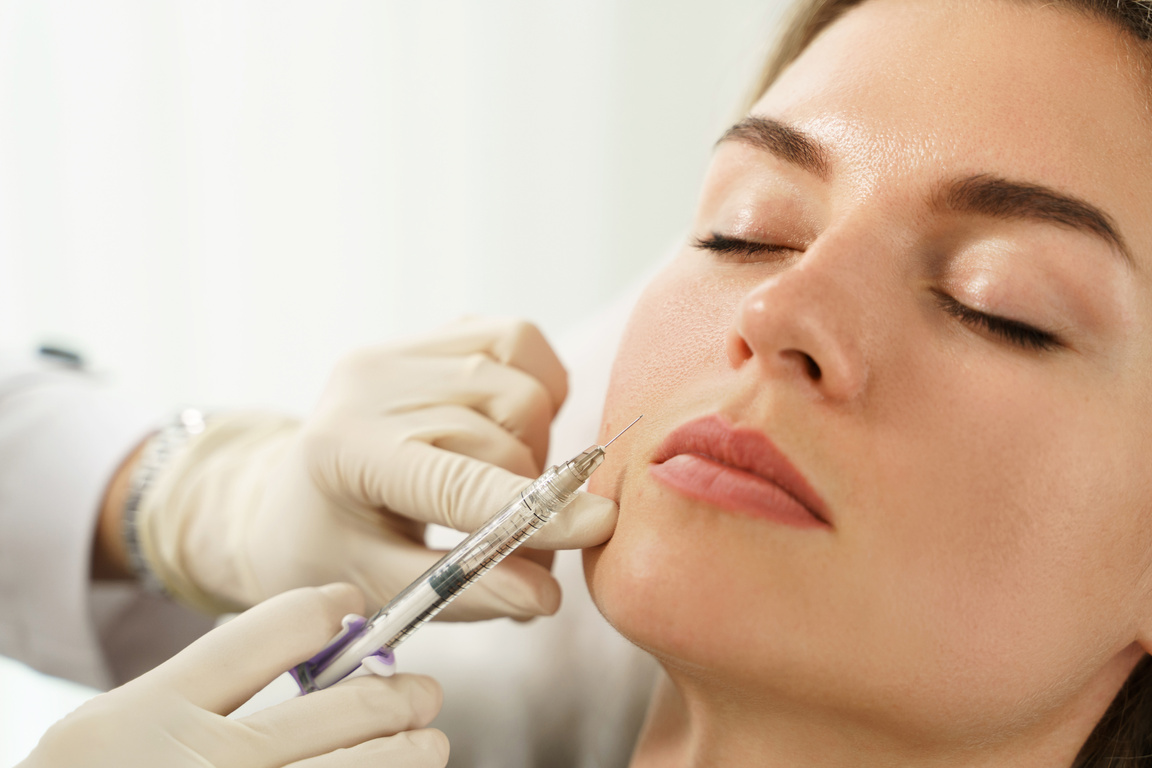 Woman during Facial Filler Injections in Aesthetic Medical Clini